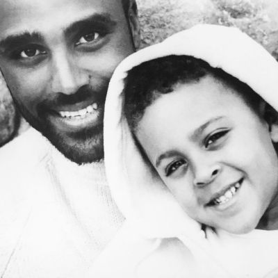 A childhood picture of Kyle Fox with his father, Rick Fox.